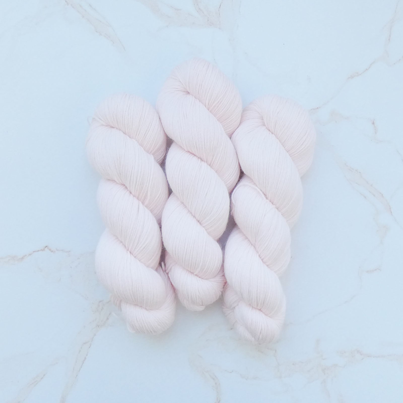 Wandering Flock Baby Paca Yarn - Dusty Blue Colorway, made from 50% Extra Fine Merino, 30% Baby Alpaca, and 20% Nylon, with a high twist 4-ply structure, perfect for Lite Sport or fat fingering substitute