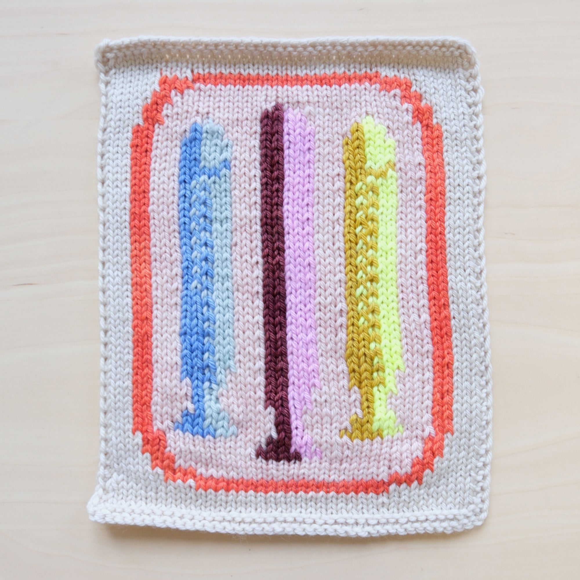 Knit swatch featuring a colorful fish design.