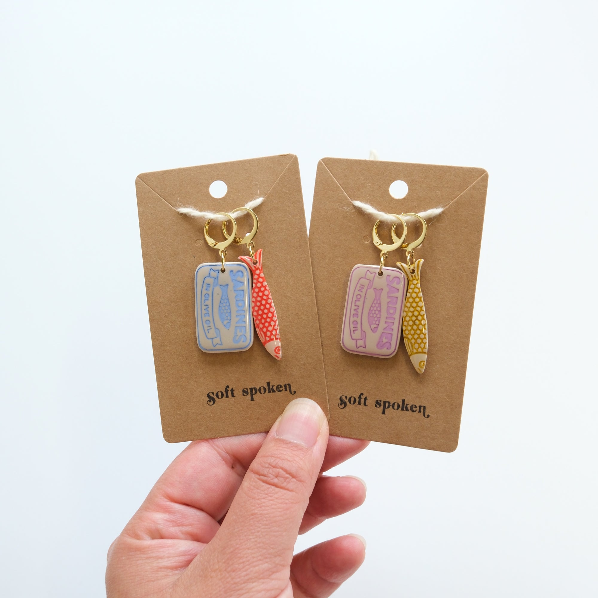 Two sets of progress markers on display cards held by a hand against a white background