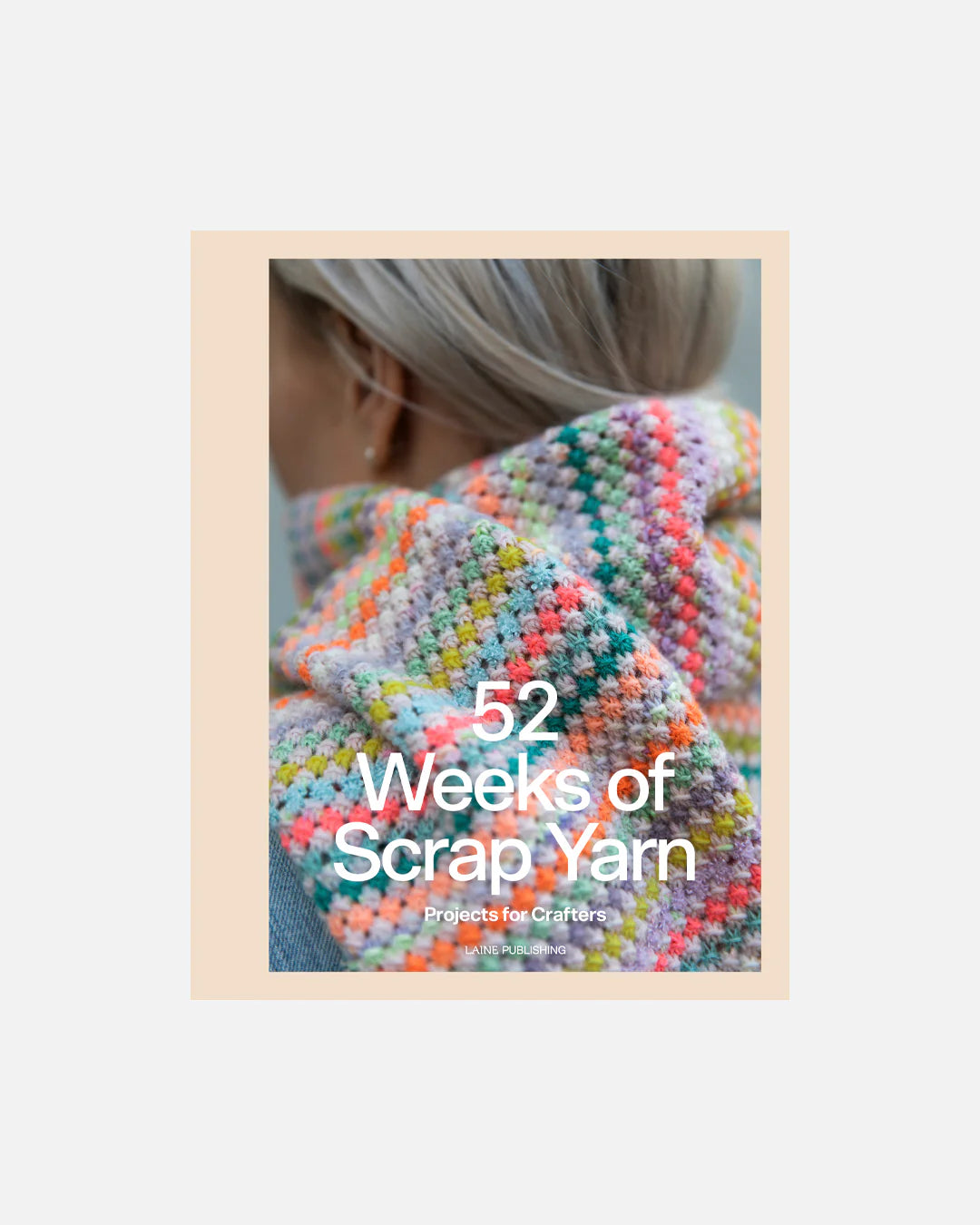 Book cover titled '52 Weeks of Scrap Yarn' with a person wearing a colorful and textured knit wrap.